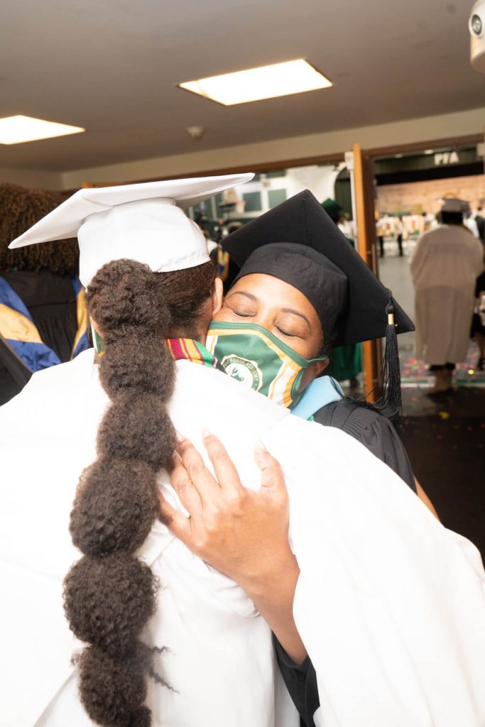 Graduates Hugging