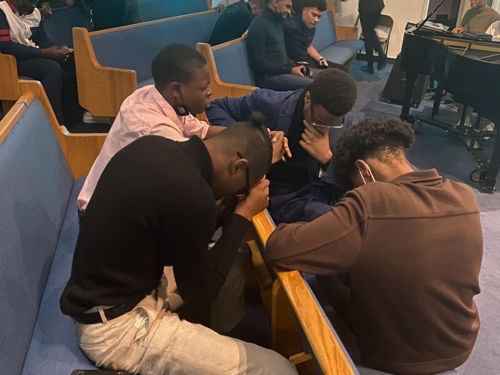 Students Praying at a Church Service